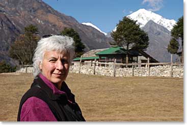 Sharon stands in front of the Himalayas