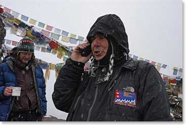 George F. on his phone at the summit