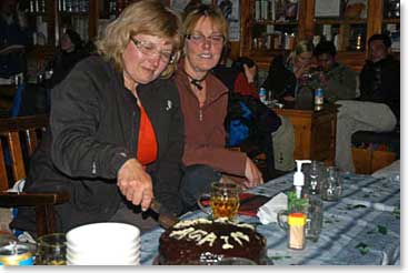 Gerry cuts into the groups farewell cake in Lukla