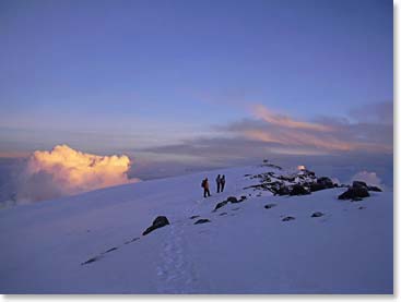 Approaching the summit sign in the snow