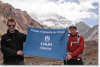 Alain and Isabelle raising epilepsy awareness with the CHUM banner