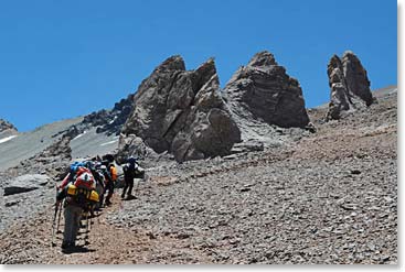 The team hikes past Conway Rocks, a landmark on the way up to Plaza Canada