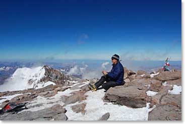 A rare moment – Kelly enjoys the summit of Aconcagua, warm with no winds.