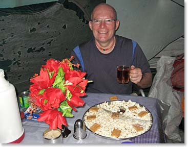 Dave enjoying afternoon tea and popcorn at Big Tree Camp