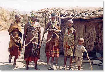 A group of Datoq women outside of their home.