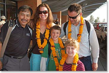 The Clarke family meets with Ang Temba at the airport.