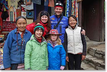 Old friends and new in Namche. Jamie and Family with a Tibetan mother and daughter who run one of our favourite shops in Namche.