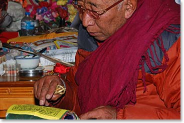 Lama Geshe reads a prayer for the group.