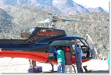 The team helps with loading the B3 helicopter.