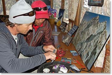 Scott and Tshering hard at work with the radios and satellite phones.