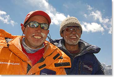 At the closing of the pooja ceremony, Tsampa flour is spread on the faces of team members and guests for blessing and good fortune.  Climbing Sherpas Pemba Dorjee and Nwang are blessed at the pooja ceremony.