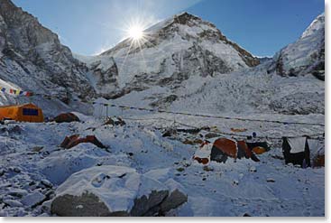 The sun rises on a beautiful snowy base camp.