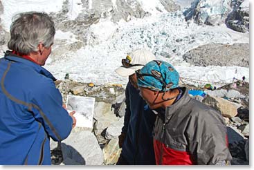 Outside, David compares historical photo with today’s Icefall with two Sherpas.