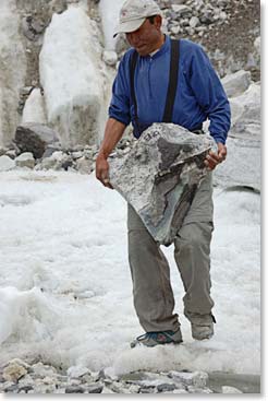 Aarita moving big rock that looks like it might be useful.