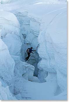 Jamie climbs through icy jaws in the lower icefall, early in the morning.