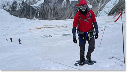 Jamie moving above Camp I toward Camp II. The guys are wearing masks to warm and humidify the cold dry air that they breathe up here.