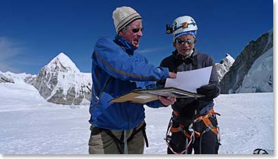 David Breashears arrived a Camp I for a couple days work. He seems to always be carrying old photos to examine. Here David and Scott look at photos the Swiss took from the Western Cwm in 1952.