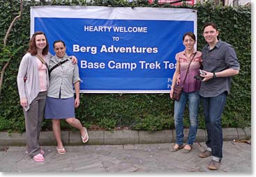 The team poses with their Berg Adventures welcome banner.