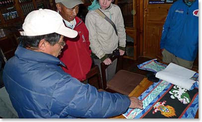 Pasang Sherpa with some of his paintings