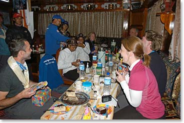 Everyone sits down to celebrate Adam's birthday with a delicious dinner.