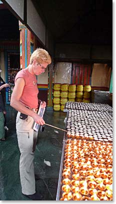 Chris lighting a candle in the monastery