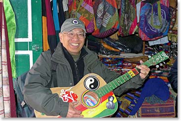 James trying out a local guitar. He was surprised how in tune it was.