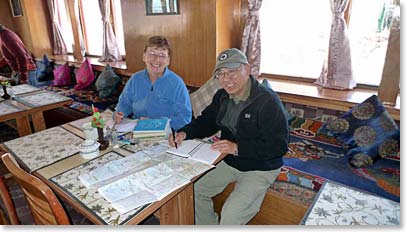 Brenda and James take some time out to keep their diaries updated.