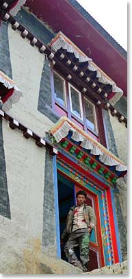 Namche local takes a break from repainting the monastery.