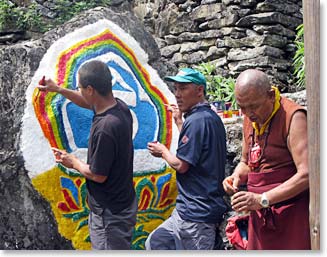 New drawings are being done along the trails with a monk's supervision.