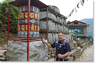 George with a prayer wheel we passed by along the trek.