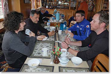 The gang gets together for tea and a game of cards.