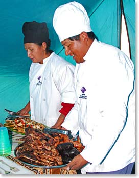 Simon, our cook, with his assistant Maria presenting lunch