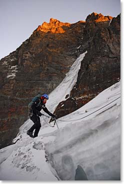 The sun illuminates the peaks around us