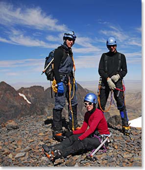 The team takes a breather on the summit.