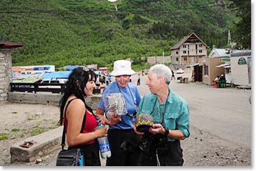 Paule and Linda show the spoils of their bargaining to Karina.