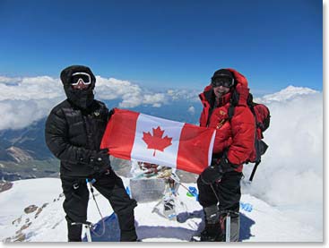 Paule and Linda proudly display flag for July 1st, Canada Day.
