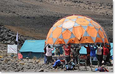 It takes a lot of porters to set up camp!