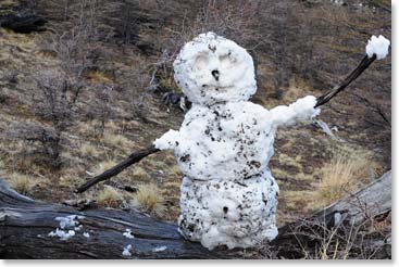 Someone built a snowman along the trail.