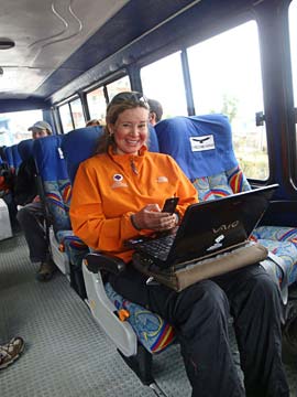 Leila working on the bus, making calls and sending dispatches