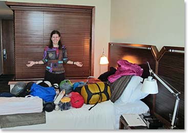 Kate is using her hotel room for last minute packing and organizing of her Antarctica gear