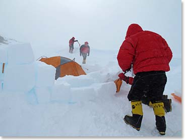 Cutting ice blocks to protect our tents from the Antarctic winds