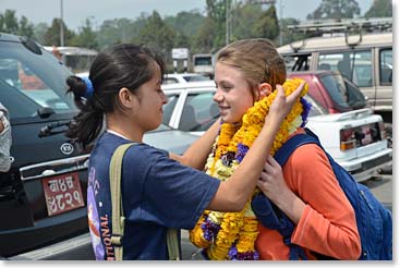 Rupa adds another garland to Mathes’ neck.