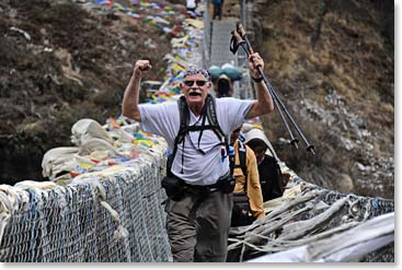 Woodie stepping off the bridge, ready for the Namche Hill