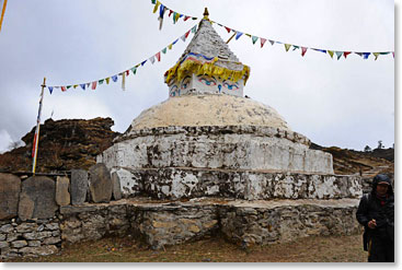 Back on the trail, we were hiking on a grey day, with clouds and rain; with Buddhist stupas along the way.