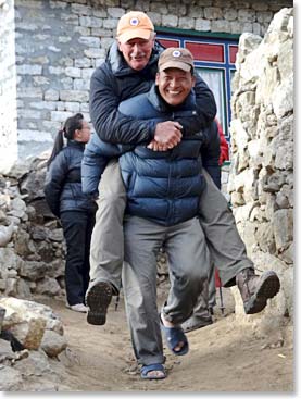 Min joyfully giving Bob a piggy back ride