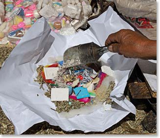 A local woman prepares a ritual to Pachamama, a goddess revered by many Andean cultures.
