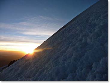 Climbing the steep slope as the sun rises