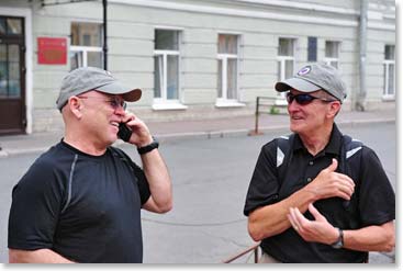 Chet and Dick enjoy a phone call home to Dick's wife Terri from the streets of St. Petersburg.