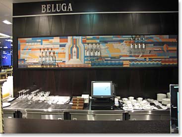 In an upscale supermarket across the street, shoppers enjoy shots of Beluga Vodka during breaks from their consumerism.