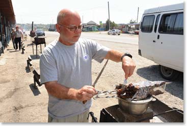 A few hours later we were out on the main road at our favorite place to stop for refreshments.  With a surgeon’s skilled hands Chet inspects the cuts of lamb on the grill.